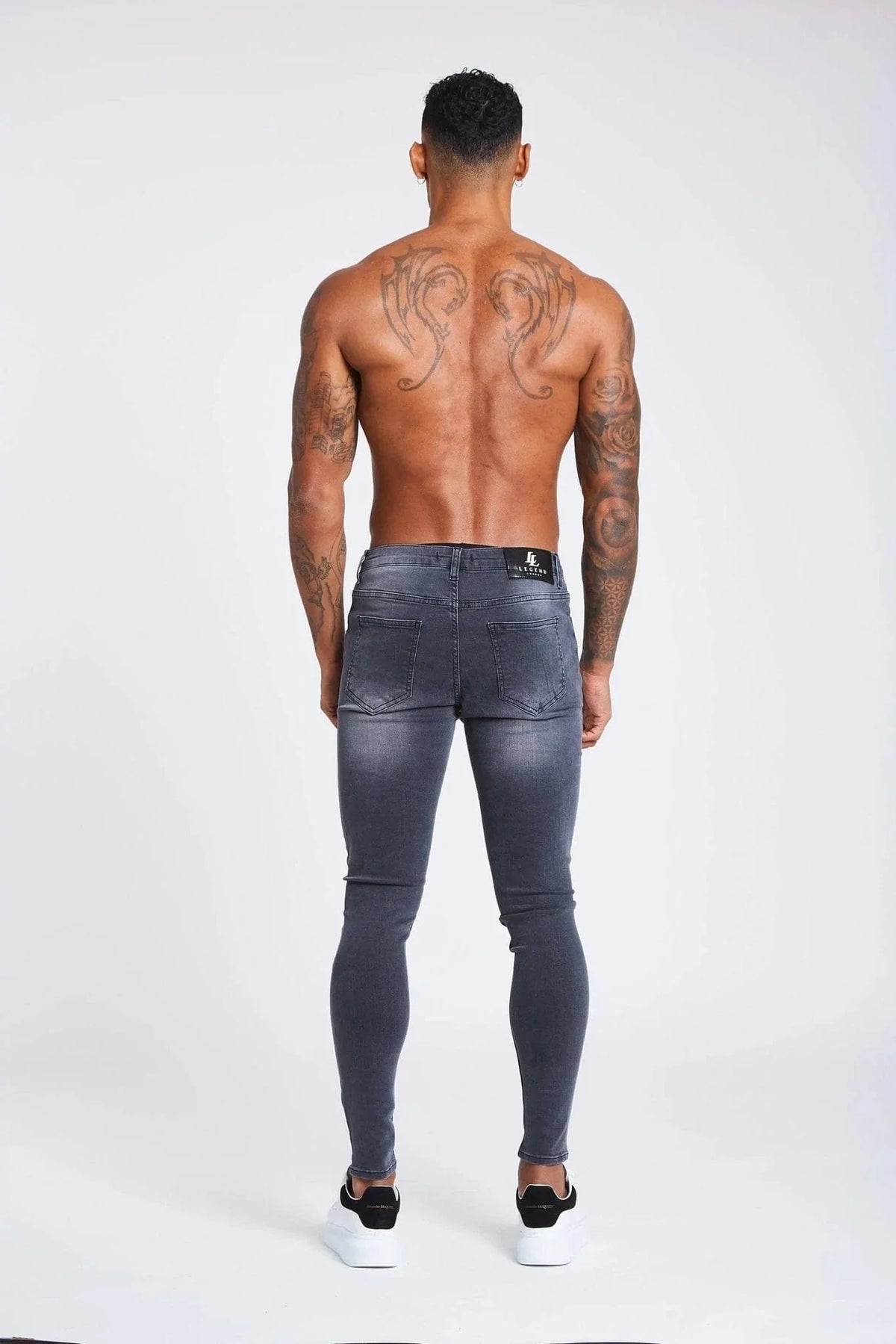 PANTALONES VAQUEROS AJUSTADOS RASGADOS GRIS OSCURO
