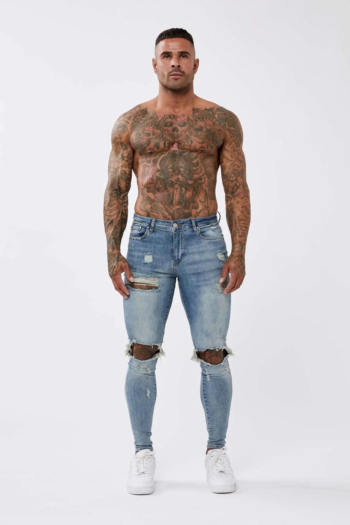PANTALONES VAQUEROS AJUSTADOS RASGADOS AZUL MEZCLILLA
